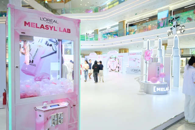 Pink laboratory-inspired product discovery displays inside the Melasyl Lab